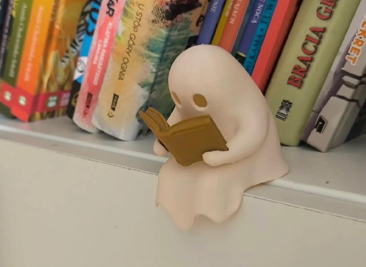 Ghost reader book shelf sitter. Light up, wonderful ornament